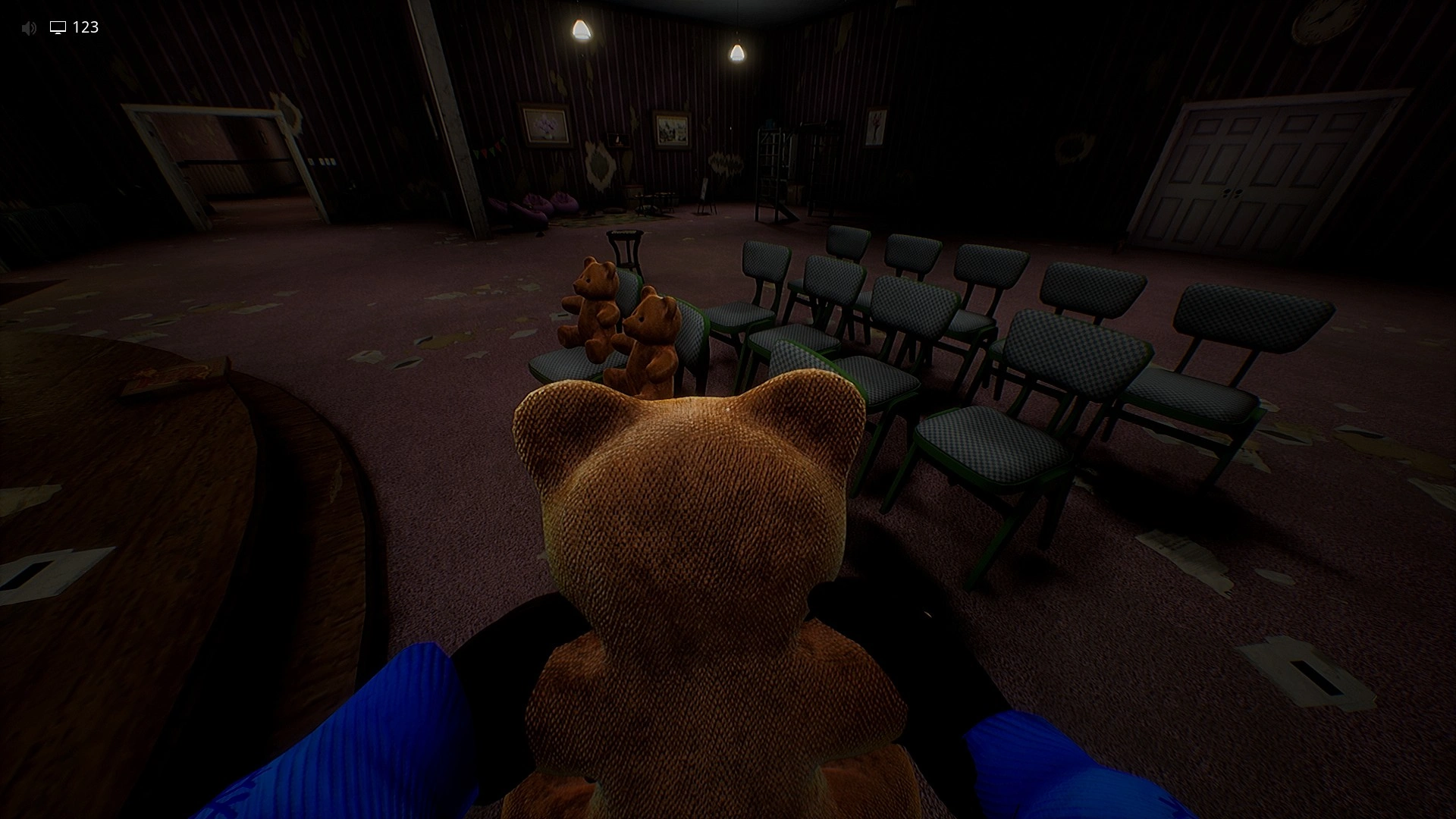 The chairs in front of the stage where you seat all 12 Teddy Bears in Level 974 Kitty's House, Escape The Backrooms