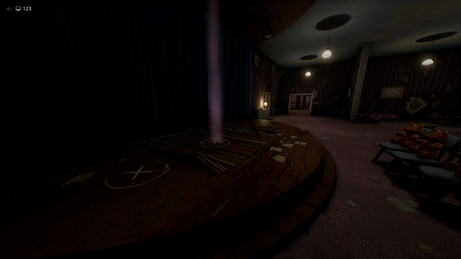The marked spot on the stage you stand on to finish Level 974 Kitty's House, Escape The Backrooms